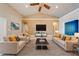Comfortable living room with neutral decor, stylish furnishings, and a large flat screen TV at 3551 Buckingham Ct, St Cloud, FL 34772