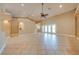 Open living room area with vaulted ceilings and access to the outdoor space at 3551 Buckingham Ct, St Cloud, FL 34772