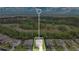 An aerial view highlights the home's location near lush surroundings and neighboring houses at 3881 Wind Dancer Cir, St Cloud, FL 34772