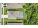Aerial view of a home featuring a screened pool and well-maintained landscaping at 3881 Wind Dancer Cir, St Cloud, FL 34772
