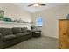 Relaxing bedroom featuring a comfortable sofa and a wall-mounted shelf at 3881 Wind Dancer Cir, St Cloud, FL 34772