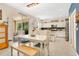 Eat-in kitchen featuring a large island, stainless appliances, and sliding glass doors leading to the lanai at 3881 Wind Dancer Cir, St Cloud, FL 34772