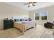 Large main bedroom with natural light, ceiling fan, and neutral carpeting at 3881 Wind Dancer Cir, St Cloud, FL 34772