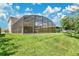 Spacious backyard with a screened-in pool, perfect for relaxing and enjoying the outdoors at 3881 Wind Dancer Cir, St Cloud, FL 34772
