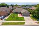 Aerial view of a landscaped home with a brick walkway and a well-manicured lawn at 404 N Sundance Dr, Lake Mary, FL 32746