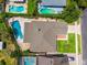 Aerial view showing the house and pool, along with the neighboring houses and pools at 404 N Sundance Dr, Lake Mary, FL 32746