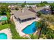 Aerial shot of backyard oasis with pool, lanai, and lush landscaping at 404 N Sundance Dr, Lake Mary, FL 32746