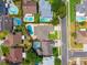 Aerial view showing the property outlined in red, situated among several neighboring swimming pools at 404 N Sundance Dr, Lake Mary, FL 32746