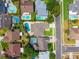 Aerial view of homes with swimming pools in a residential neighborhood at 404 N Sundance Dr, Lake Mary, FL 32746