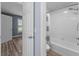 Light blue bathroom featuring a shower/tub combo and wood flooring at 404 N Sundance Dr, Lake Mary, FL 32746
