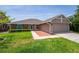 Charming single-story home with a well-manicured lawn and a two-car garage at 404 N Sundance Dr, Lake Mary, FL 32746