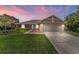 Charming single-story home with a well-manicured lawn and a two-car garage at 404 N Sundance Dr, Lake Mary, FL 32746
