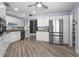 Beautiful eat-in kitchen with stainless steel refrigerator and granite countertops at 404 N Sundance Dr, Lake Mary, FL 32746