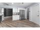 Eat-in kitchen with stainless steel refrigerator and ample storage at 404 N Sundance Dr, Lake Mary, FL 32746