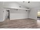 Open living area showcases wood floors and natural light from access to the outdoor patio at 404 N Sundance Dr, Lake Mary, FL 32746