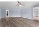 Spacious living room with wood-look flooring and light blue walls at 404 N Sundance Dr, Lake Mary, FL 32746