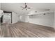 Bright living room features vaulted ceiling, ceiling fan, and wood flooring at 404 N Sundance Dr, Lake Mary, FL 32746