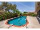 Sparkling blue pool surrounded by lush landscaping and a privacy fence at 404 N Sundance Dr, Lake Mary, FL 32746