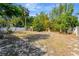 Lush backyard with privacy fence, mature trees, and potential for outdoor enjoyment at 407 S Lakemont Ave, Winter Park, FL 32792