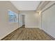 Bright bedroom features wood floors, closet, and natural light from a window at 407 S Lakemont Ave, Winter Park, FL 32792