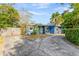 Exterior view of a home featuring a circular driveway and a well-maintained yard at 407 S Lakemont Ave, Winter Park, FL 32792