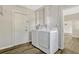 Laundry area with modern washer and dryer, convenient access and neutral tones at 407 S Lakemont Ave, Winter Park, FL 32792