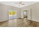 Living room featuring wood floors, sliding glass doors, and a ceiling fan at 407 S Lakemont Ave, Winter Park, FL 32792