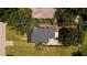 Aerial view of the property showcasing the roof and a well-maintained backyard and grounds at 415 Florida Ave, St Cloud, FL 34769