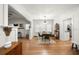 Bright dining area showcasing hardwood floors and seamless connection to living room and kitchen at 415 Florida Ave, St Cloud, FL 34769