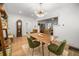 Elegant dining room with modern chandelier, stylish seating, and warm hardwood floors at 415 Florida Ave, St Cloud, FL 34769