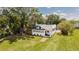 A lovely single-Gathering home with mature trees and lush landscaping in a serene setting at 415 Florida Ave, St Cloud, FL 34769