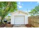A detached one-car garage with a white exterior and a well-maintained appearance at 415 Florida Ave, St Cloud, FL 34769