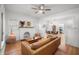 Open concept living room with a fireplace and seamless flow into the dining area at 415 Florida Ave, St Cloud, FL 34769