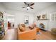 Inviting living room featuring a decorative fireplace, hardwood floors, and ample natural light at 415 Florida Ave, St Cloud, FL 34769