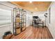 Bright home office with wood floors, wood ceiling, shelving, and modern desk setup at 415 Florida Ave, St Cloud, FL 34769