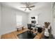 Bright home office featuring hardwood floors, a modern desk setup, and natural light at 415 Florida Ave, St Cloud, FL 34769