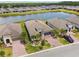 Aerial view of the property showcasing the home, lake, and surrounding community at 433 Via Abruzzi St, Kissimmee, FL 34759