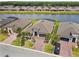 Beautiful home showcasing a paved driveway, complemented by lush landscaping and a serene lakeside setting at 433 Via Abruzzi St, Kissimmee, FL 34759