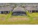 Aerial view featuring a screened-in pool and an expansive green backyard at 433 Via Abruzzi St, Kissimmee, FL 34759