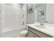 Bright bathroom features a shower over tub and modern vanity at 433 Via Abruzzi St, Kissimmee, FL 34759