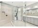 Bathroom features double vanity, large mirror, and walk-in shower at 433 Via Abruzzi St, Kissimmee, FL 34759