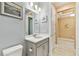 Cozy bathroom boasts a large mirror, updated vanity and tiled floors at 433 Via Abruzzi St, Kissimmee, FL 34759