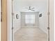 Clean, bright bedroom with neutral walls, tile flooring, and window at 433 Via Abruzzi St, Kissimmee, FL 34759