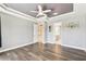 Bedroom boasts dark wood floors, ceiling fan and ample natural light at 433 Via Abruzzi St, Kissimmee, FL 34759