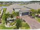 Charming single-Gathering home boasts mature landscaping, brick driveway, and a tranquil lake view at 433 Via Abruzzi St, Kissimmee, FL 34759