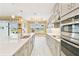Spacious kitchen with modern appliances and an island overlooking the dining area at 433 Via Abruzzi St, Kissimmee, FL 34759