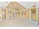 Spacious living room with tile floors, recessed lights and tray ceiling at 433 Via Abruzzi St, Kissimmee, FL 34759