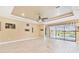 Open-concept living space features tile floors and sliding glass doors overlooking the pool at 433 Via Abruzzi St, Kissimmee, FL 34759