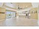 Bright, open-concept living space with tile floors and sliding glass doors to the pool at 433 Via Abruzzi St, Kissimmee, FL 34759