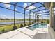 Screened-in pool boasts water view at 433 Via Abruzzi St, Kissimmee, FL 34759